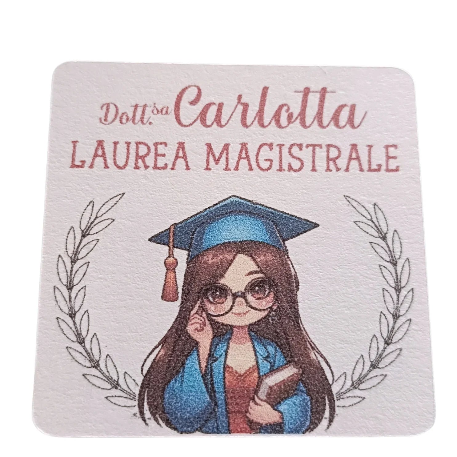 Cartoon graduate girl with glasses in cap and gown, holding a book, laurea magistrale sign
