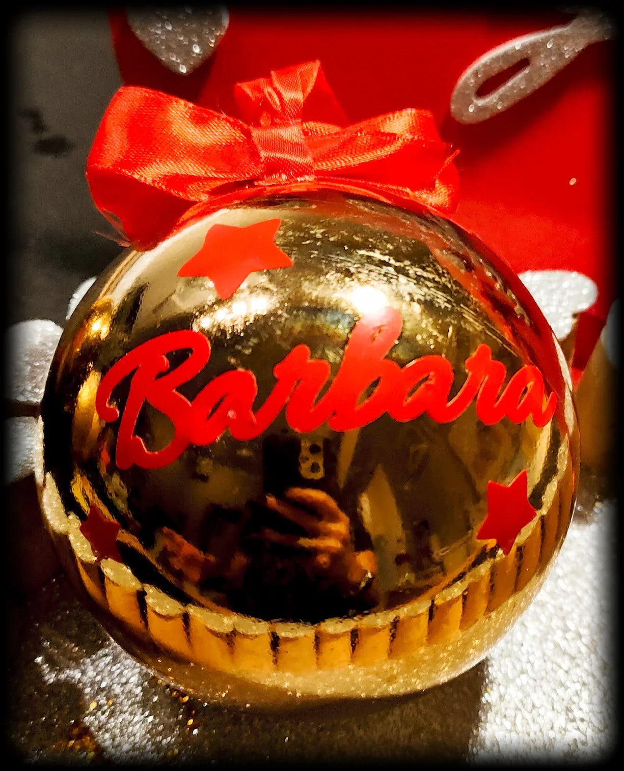 Gold Christmas ornament labeled Barbara with red stars and bow