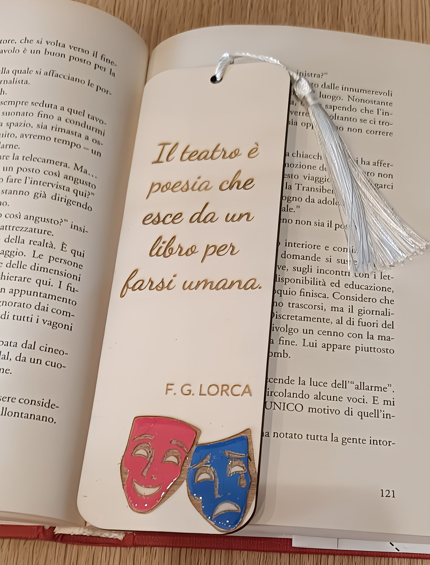 Bookmark with Italian theater quote by F.G. Lorca, comedy and tragedy masks on open book