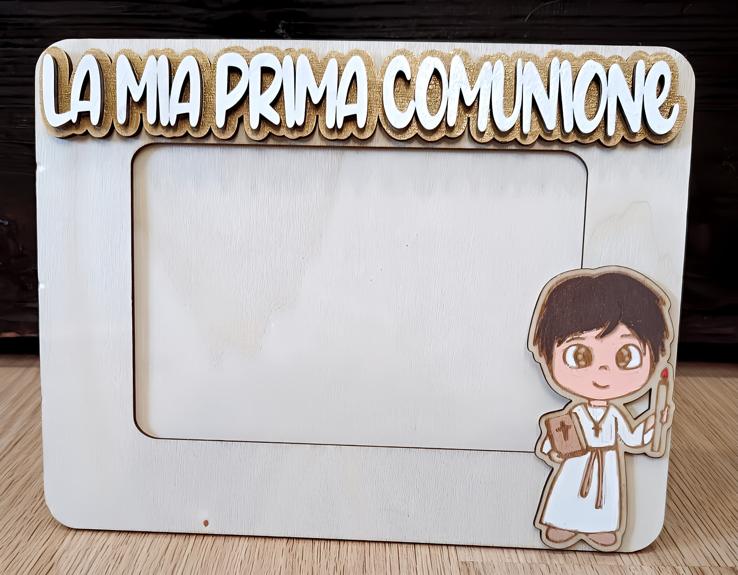 Wooden photo frame with 'La mia prima comunione' text and cartoon boy in communion attire