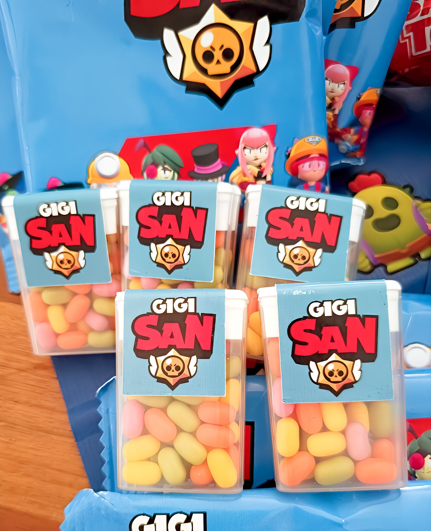 Colorful candy boxes labeled Gigi San with cartoon Brawl Stars theme on blue packaging