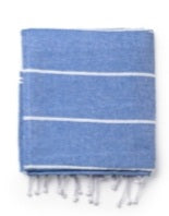 Folded blue Turkish towel with white stripes and fringe ends