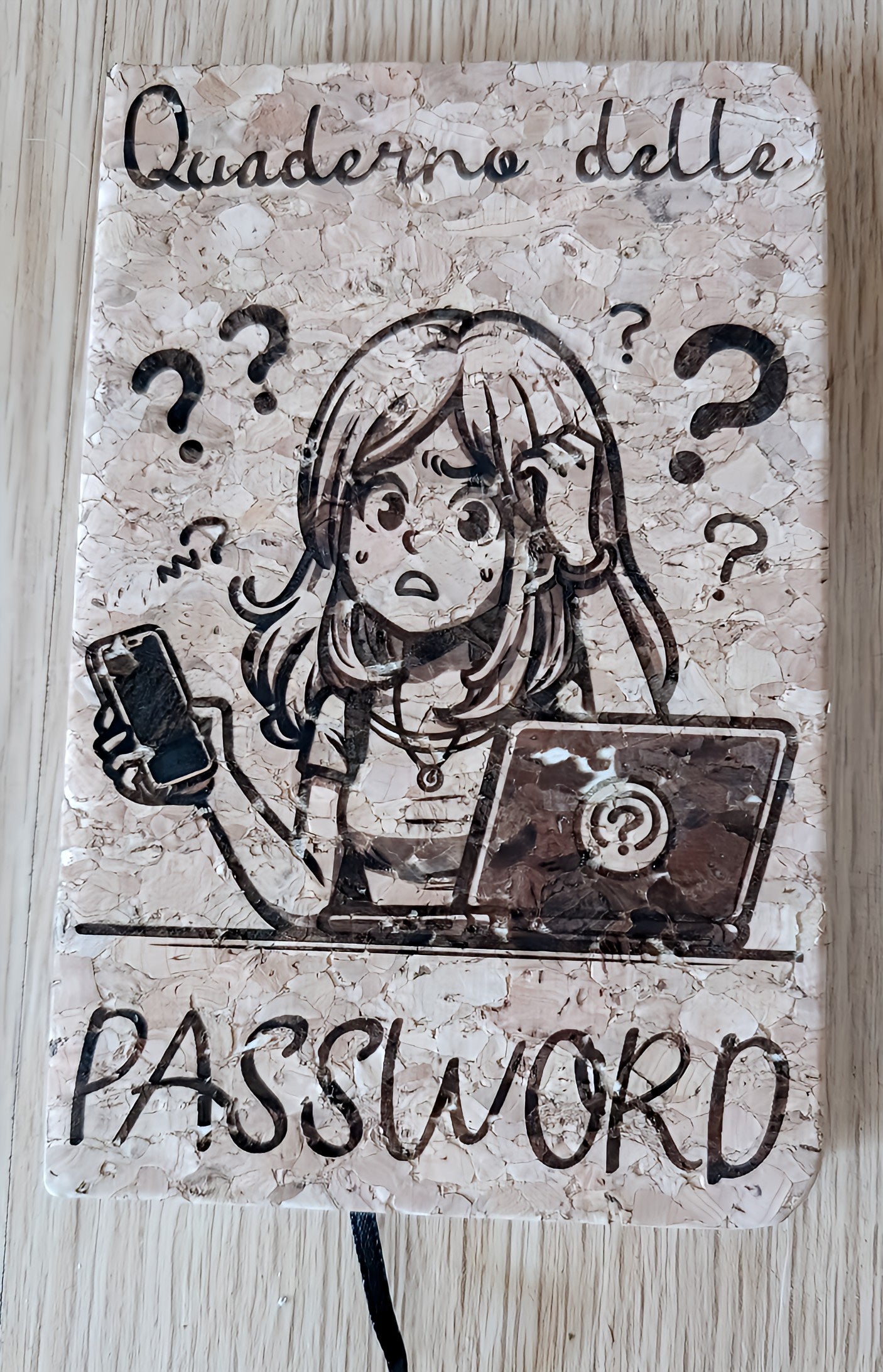 Quaderno delle password notebook with cartoon girl, phone, laptop, and question marks on cork cover