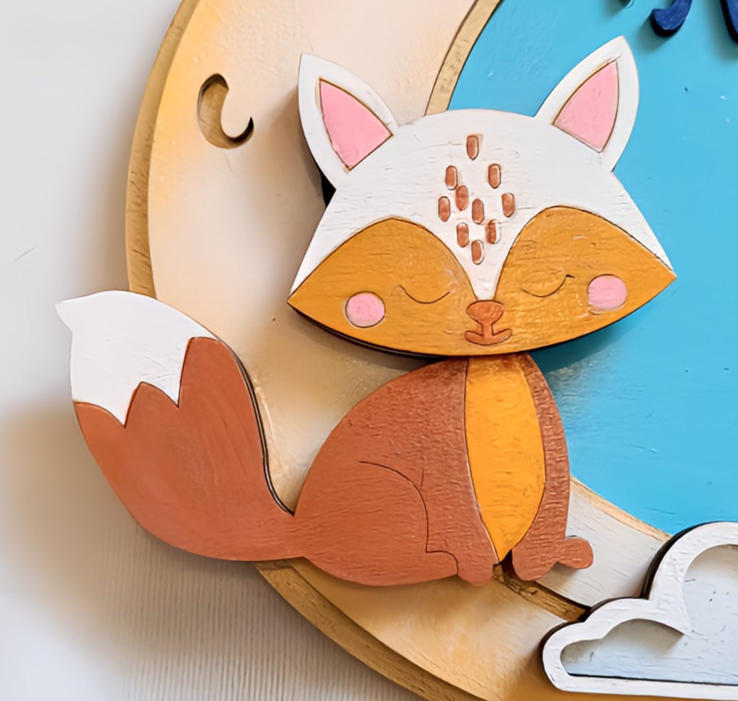 Cute wooden fox wall art with painted details and a blue background
