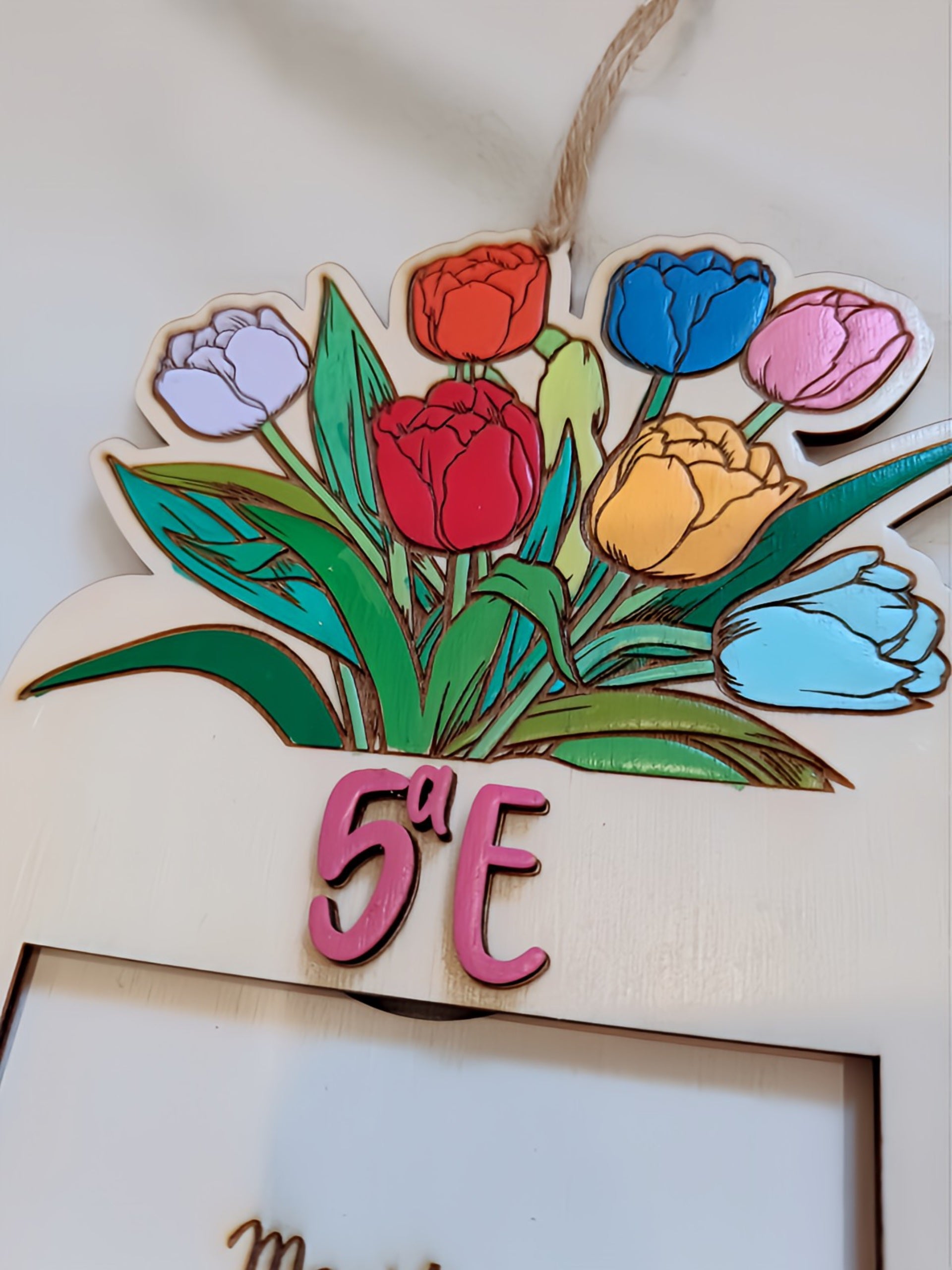 Colorful wooden sign with tulips and the text '5a E', classroom or door decor.