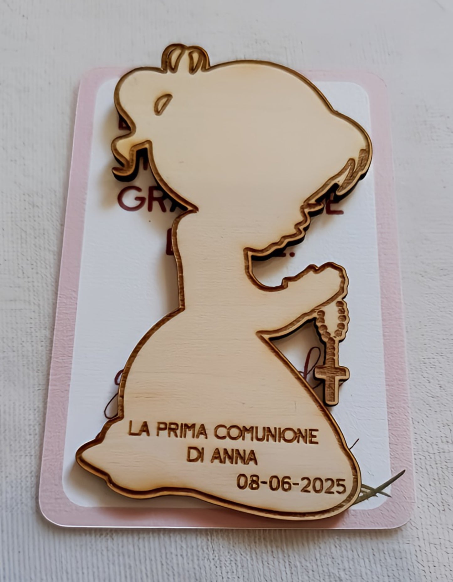 Wooden silhouette of a praying girl with rosary, engraved "First Communion of Anna 08-06-2025"
