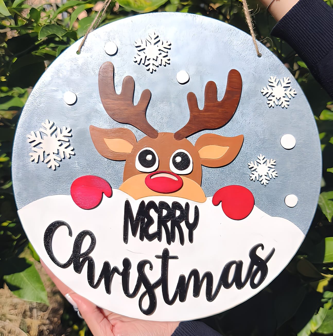 Christmas door sign with cute reindeer, snowflakes, and 'Merry Christmas' text outdoors