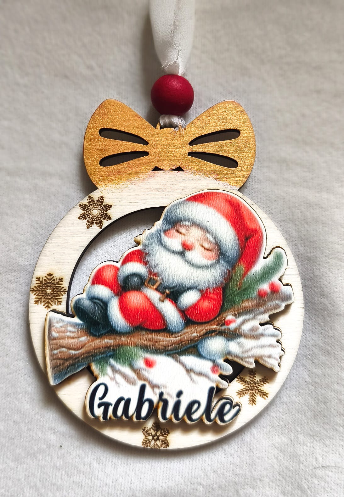 Personalized wooden Christmas ornament with Santa Claus, red bow, snowflakes, name Gabriele