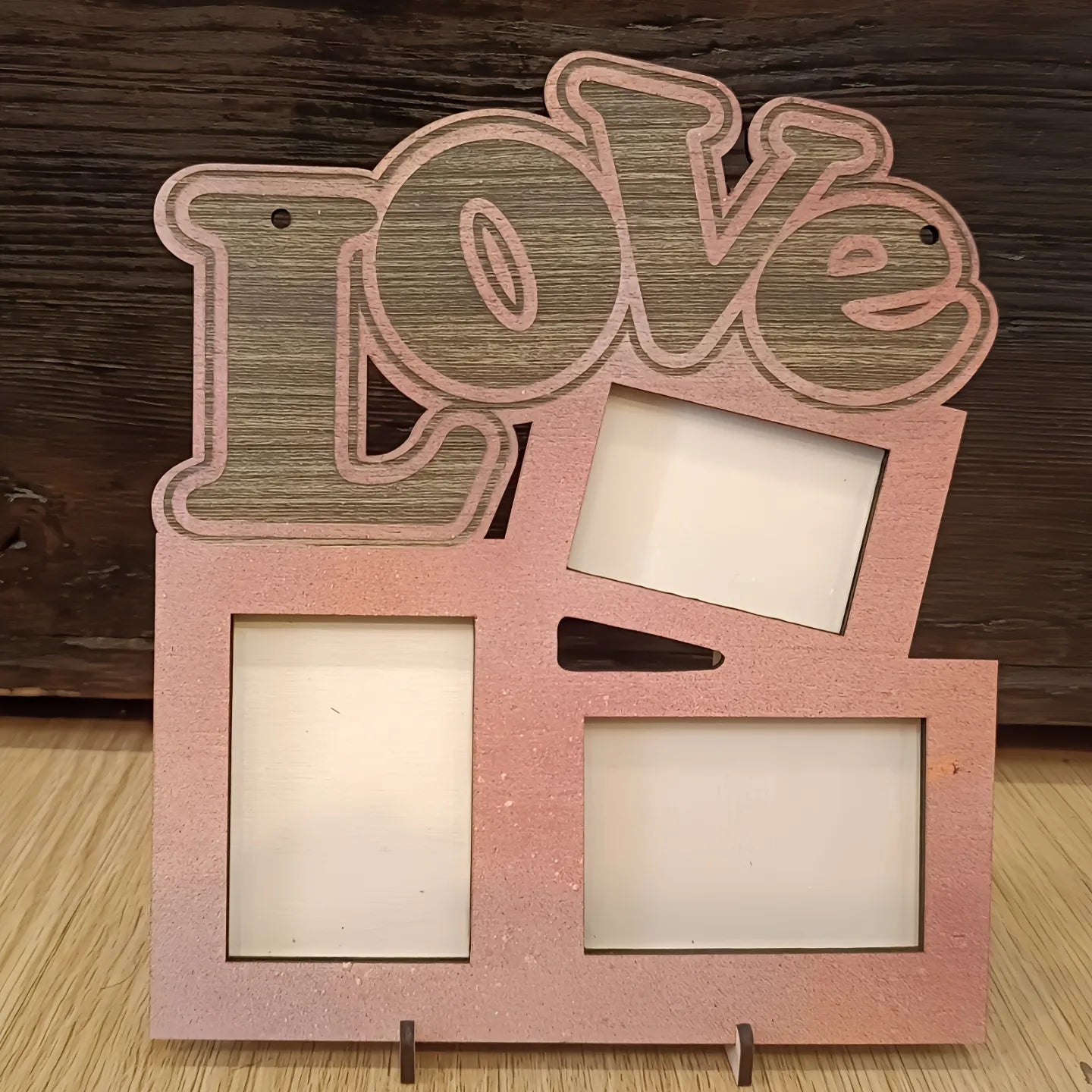 Wooden photo frame with 'Love' text, four picture slots, rustic wood background