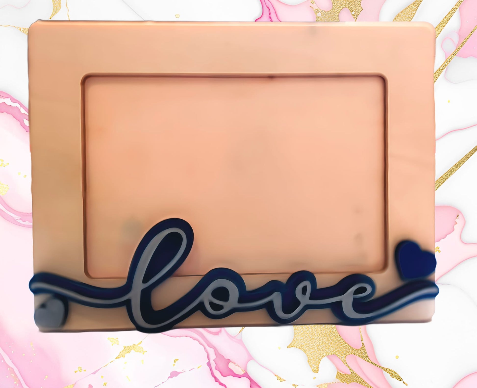 Pink photo frame with 'love' and a blue heart on a marble and gold background