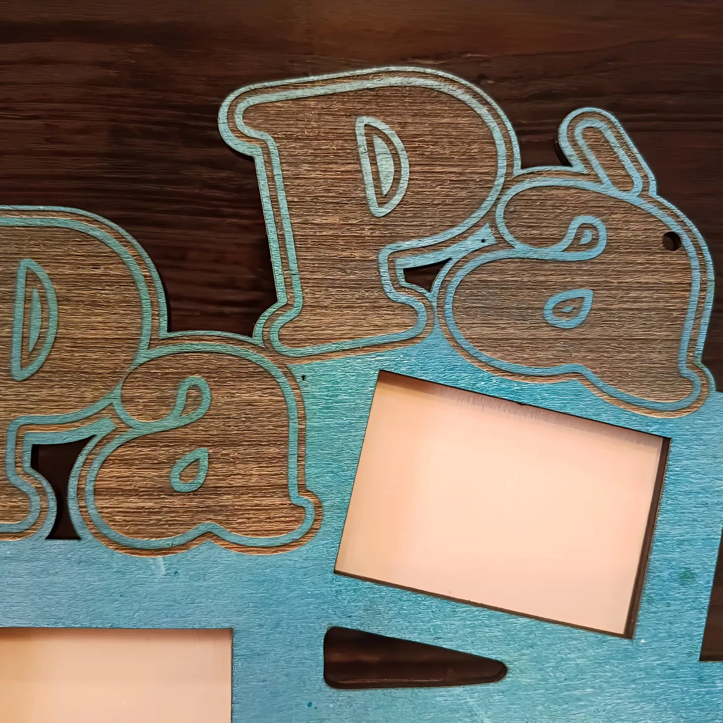 Wooden photo frame with blue gradient, 'Papá' text cutout, empty rectangular slots