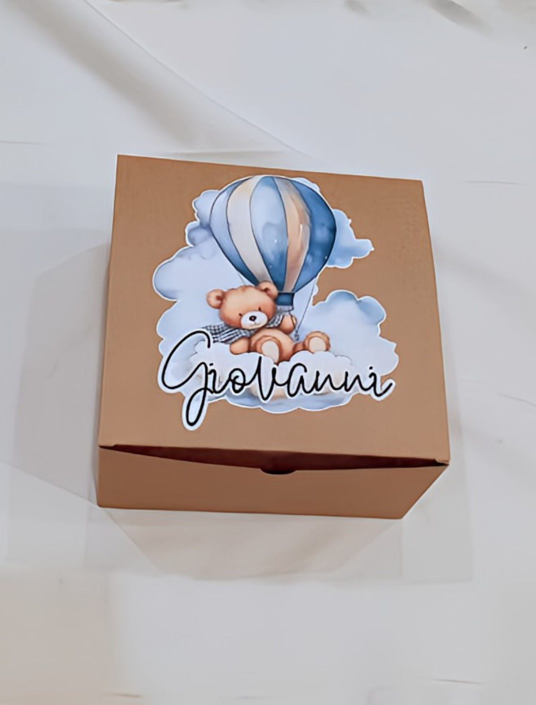 Brown gift box with teddy bear and hot air balloon design, name Giovanni on lid
